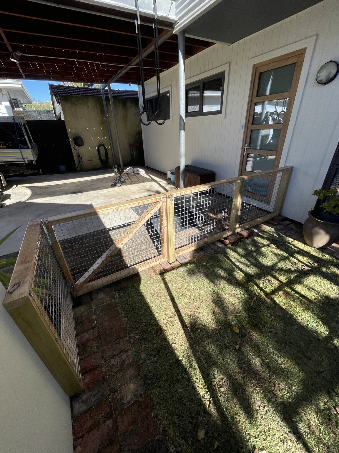 Completed custom timber and mesh gate enclosure by HandMate